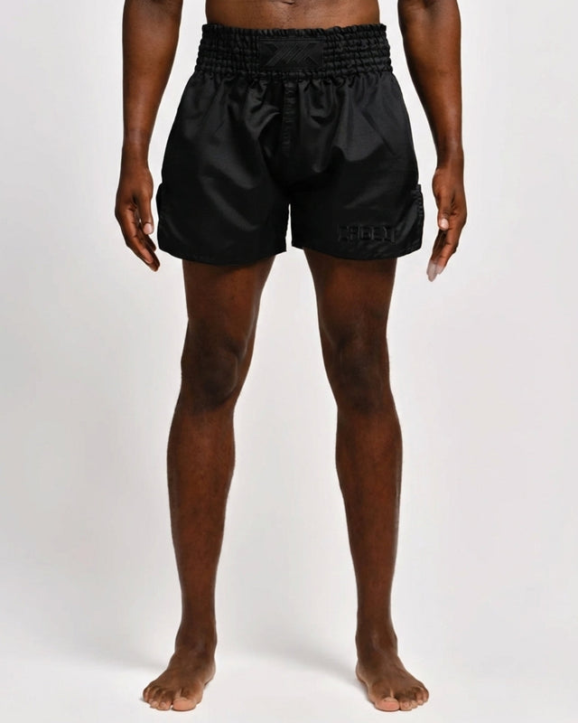 Caged Muay Thai Shorts Classic – Schwarz/Schwarz