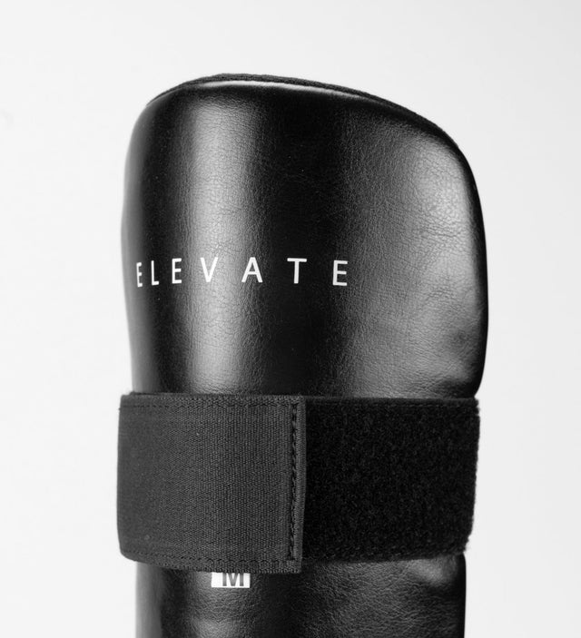 Elevate Schienbeinschoner Prime – Schwarz/Weiss