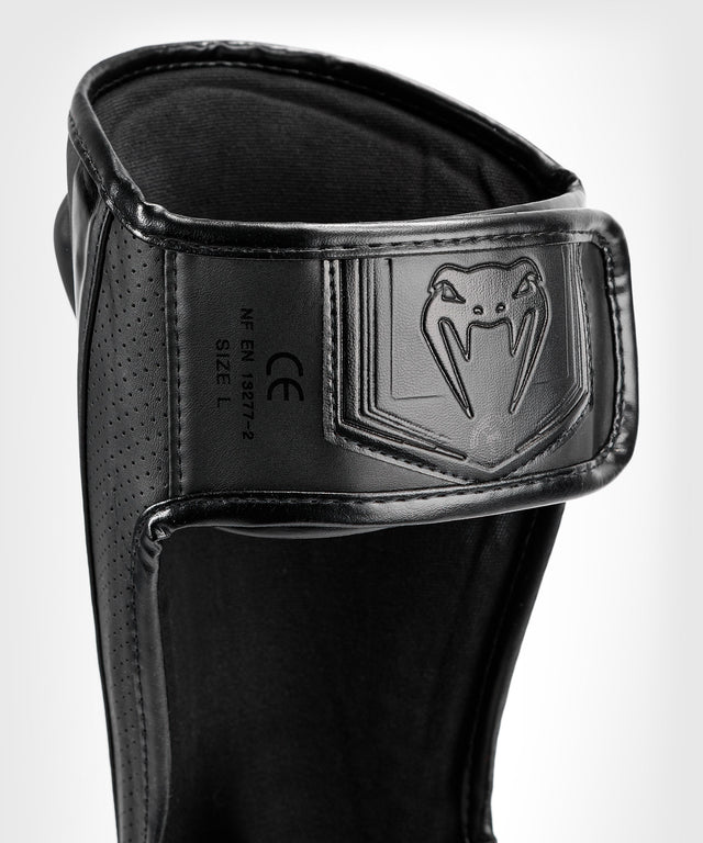 Venum Schienbeinschoner Elite Evo - Schwarz/Schwarz