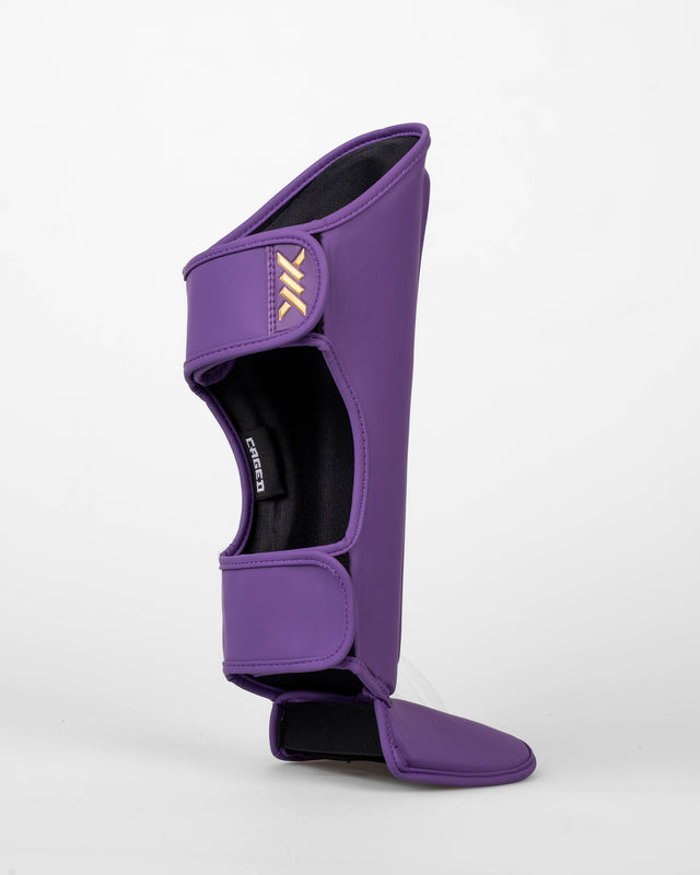 Caged Schienbeinschoner Spark Kids - Lila/Gold
